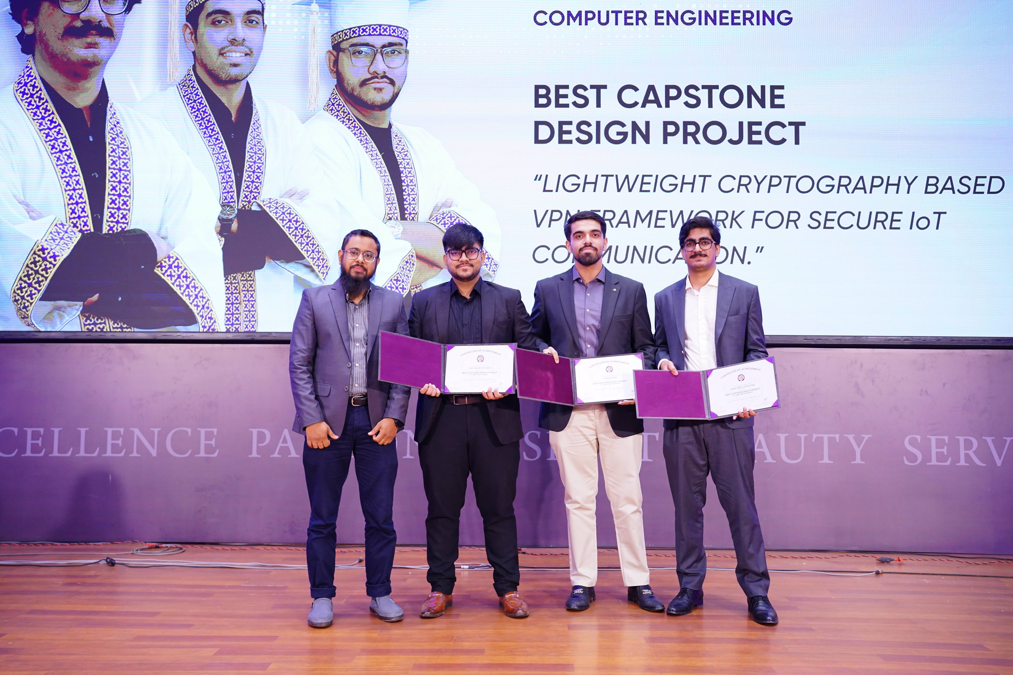 AspidIoT team receiving recognition for Best Capstone Design Project in Computer Engineering.